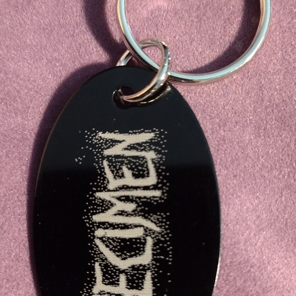 Black Keychain with White Text
